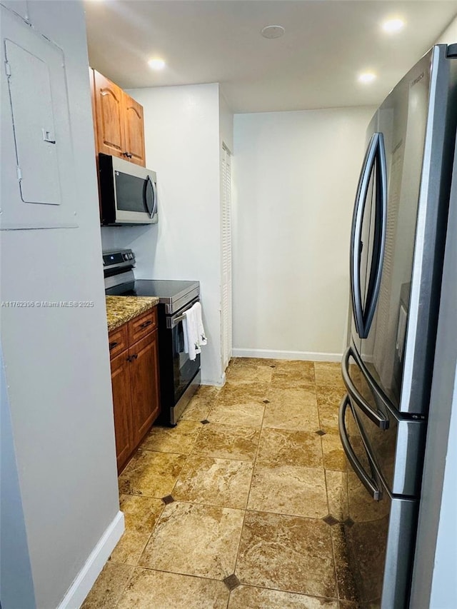 kitchen with electric panel, recessed lighting, baseboards, and appliances with stainless steel finishes