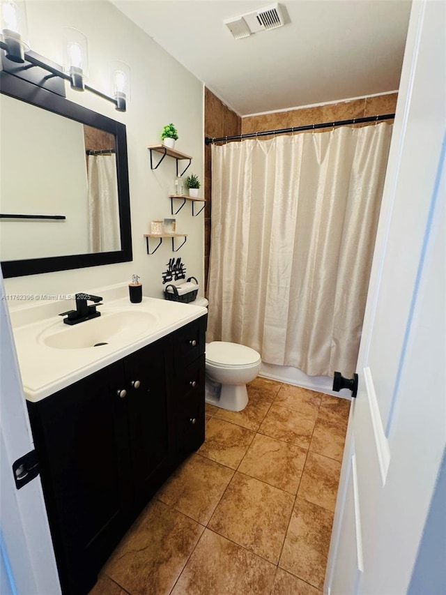 full bath featuring tile patterned floors, visible vents, toilet, curtained shower, and vanity