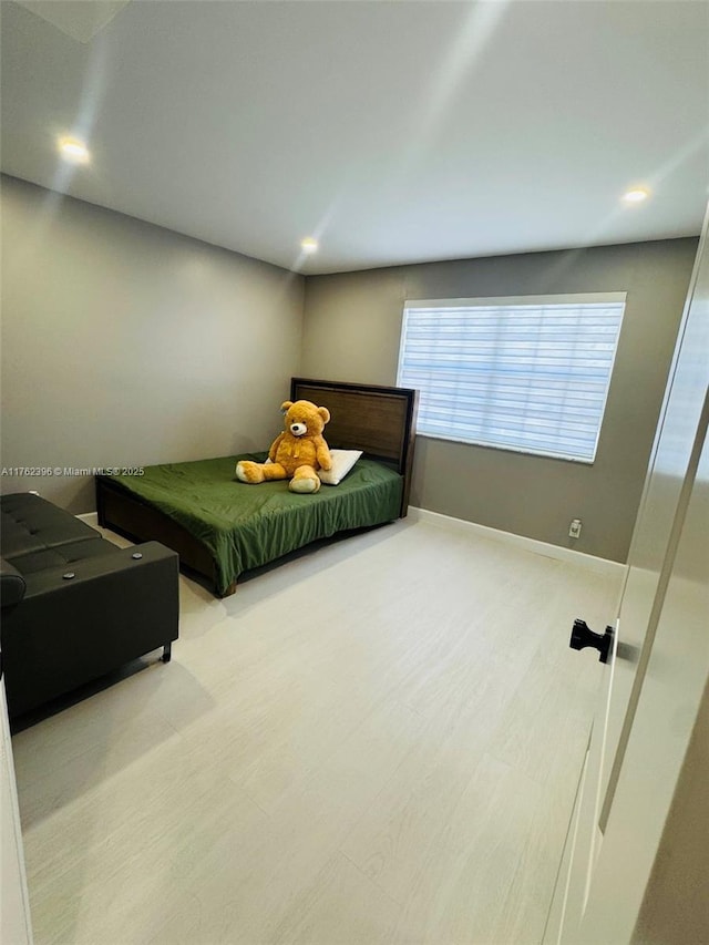 bedroom featuring recessed lighting, baseboards, and wood finished floors