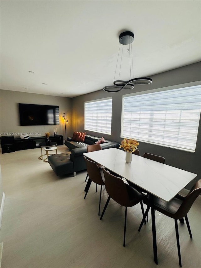 dining space with light wood-style floors