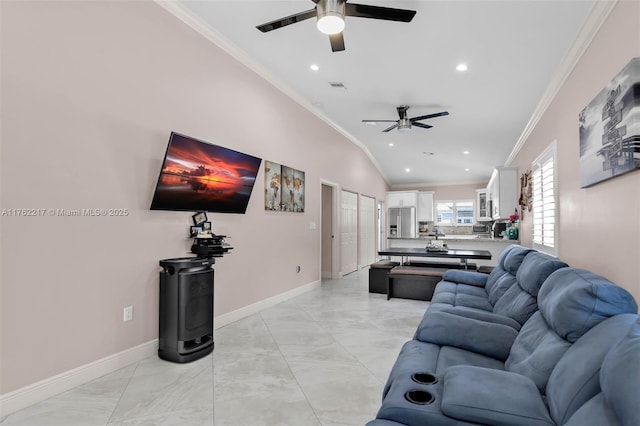 living area featuring ceiling fan, baseboards, vaulted ceiling, ornamental molding, and recessed lighting