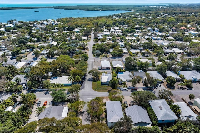 drone / aerial view with a water view and a residential view