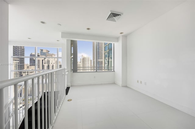 1395 Brickell Ave Unit 3401, Miami, FL 33131 - spare room with a city view, visible vents, and baseboards
