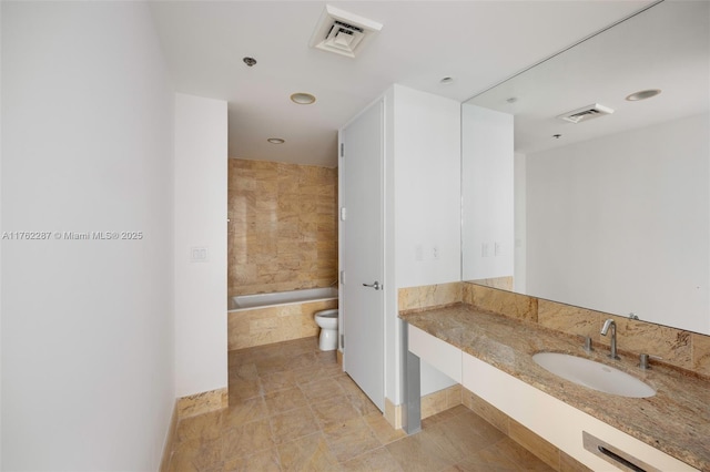full bathroom with visible vents, toilet, and vanity