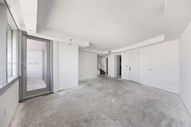 1395 Brickell Ave Unit 3411, Miami, FL 33131 - spare room featuring stairway and concrete flooring