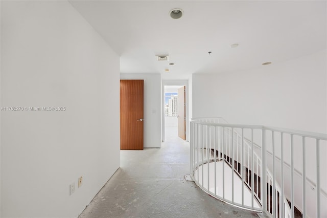 1395 Brickell Ave Unit 3411, Miami, FL 33131 - hallway featuring an upstairs landing, visible vents, and concrete floors