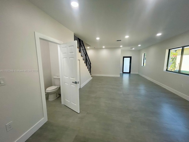 basement featuring recessed lighting, visible vents, baseboards, and stairs