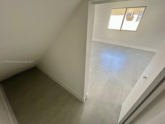 bonus room featuring baseboards