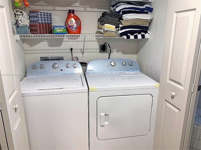 washroom with washer and dryer and laundry area