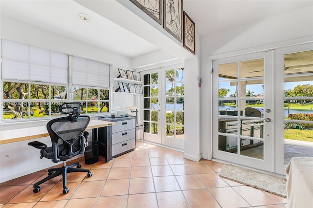 home office featuring light tile patterned floors and french doors