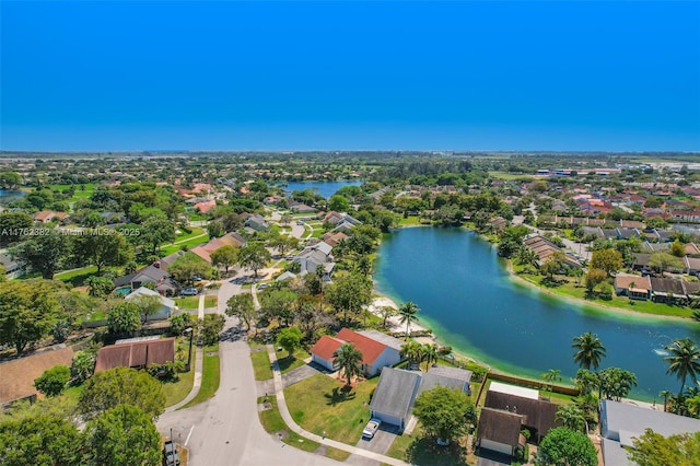 bird's eye view featuring a water view and a residential view