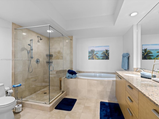 full bath with tile patterned flooring, vanity, toilet, a stall shower, and a bath