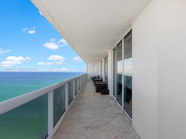 balcony featuring a water view