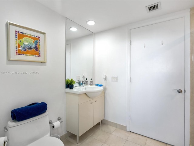 bathroom with toilet, vanity, tile patterned flooring, visible vents, and recessed lighting
