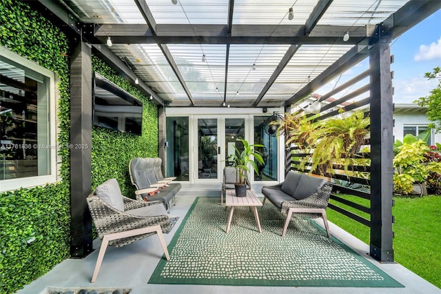 view of patio / terrace featuring an outdoor living space, french doors, and a pergola