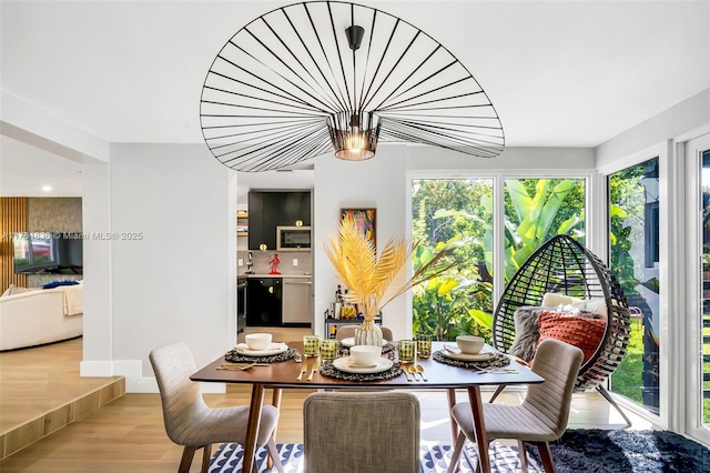 dining space featuring light wood-type flooring