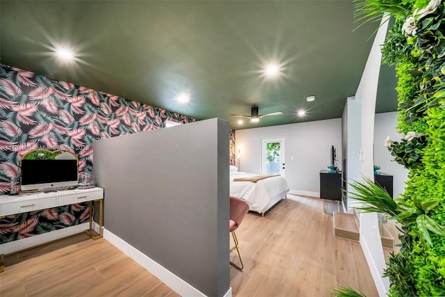 bedroom with recessed lighting, wood finished floors, and baseboards