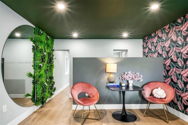 sitting room with recessed lighting, baseboards, and wood finished floors