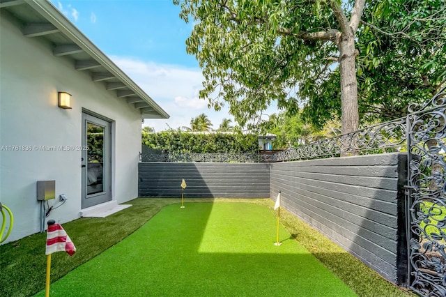 view of yard with a fenced backyard