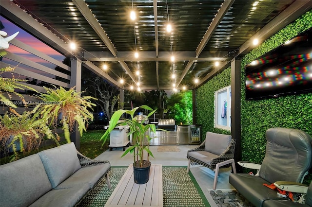 view of patio / terrace featuring exterior kitchen, outdoor lounge area, and a pergola