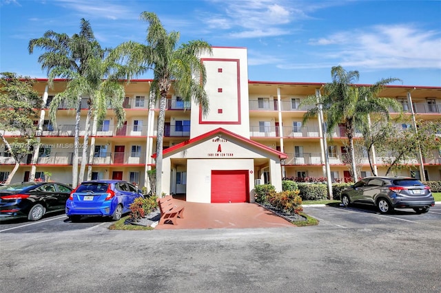 view of property with uncovered parking