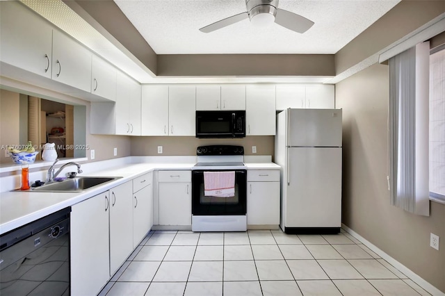 kitchen featuring a sink, black appliances, white cabinets, and light countertops