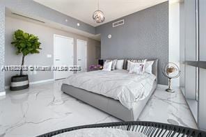 bedroom featuring visible vents, marble finish floor, and baseboards