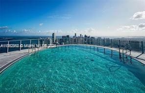 view of pool featuring fence