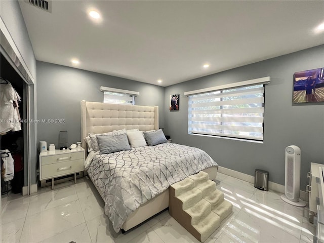 bedroom featuring multiple windows, visible vents, and marble finish floor