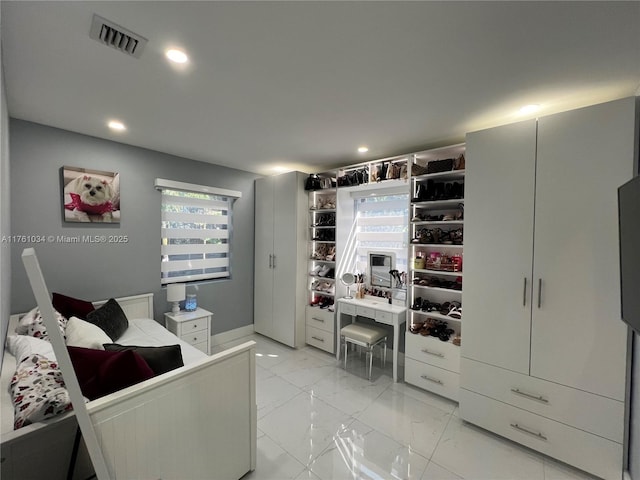 bedroom with recessed lighting, visible vents, and marble finish floor