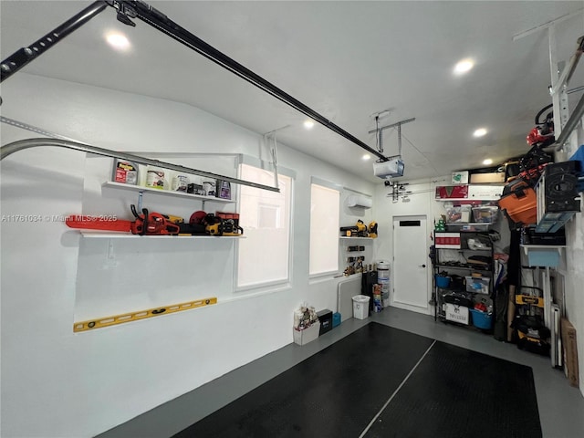 garage featuring recessed lighting and a garage door opener