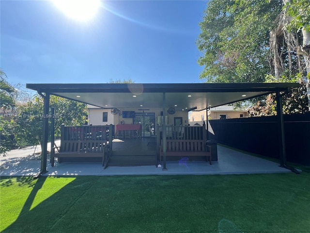 rear view of house with a yard and a patio