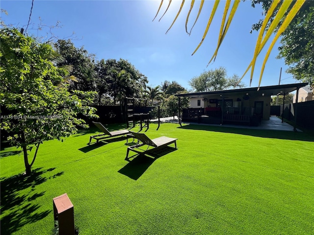 view of yard with a patio and fence