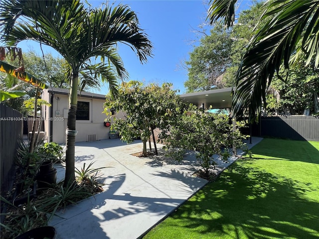 view of yard featuring a patio and a fenced backyard