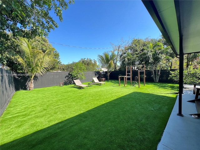 view of yard with a fenced backyard