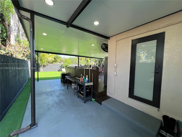 view of patio featuring fence