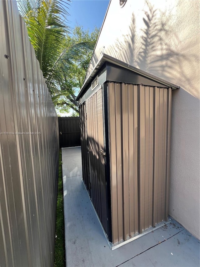 view of outdoor structure featuring a fenced backyard