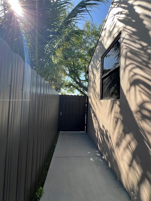 view of patio featuring a gate and fence