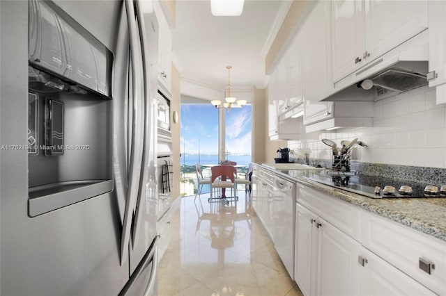 kitchen with ornamental molding, a sink, stainless steel refrigerator with ice dispenser, under cabinet range hood, and tasteful backsplash