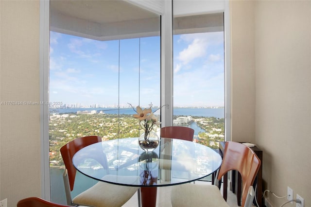 dining space featuring a water view