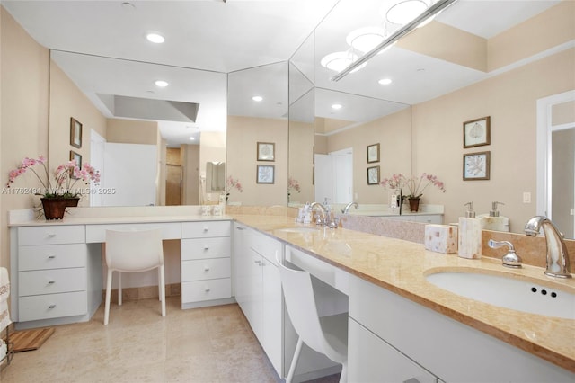 full bathroom with tile patterned flooring, double vanity, recessed lighting, and a sink