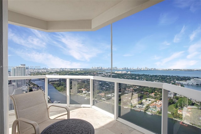 balcony with a view of city and a water view