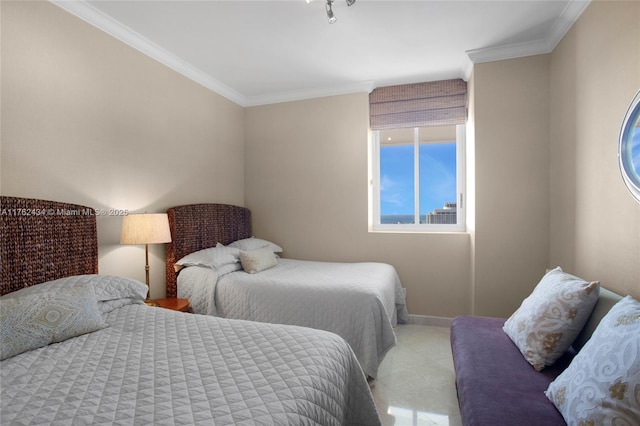 bedroom with crown molding and baseboards