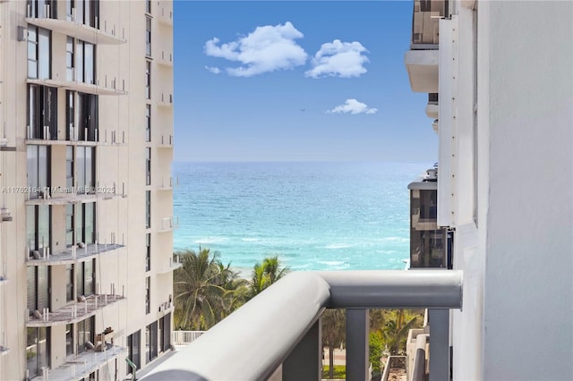 balcony featuring a water view