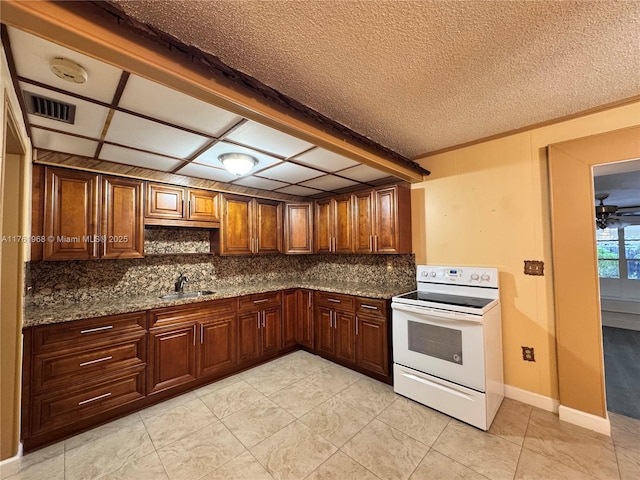 kitchen with visible vents, decorative backsplash, dark stone countertops, electric stove, and a sink