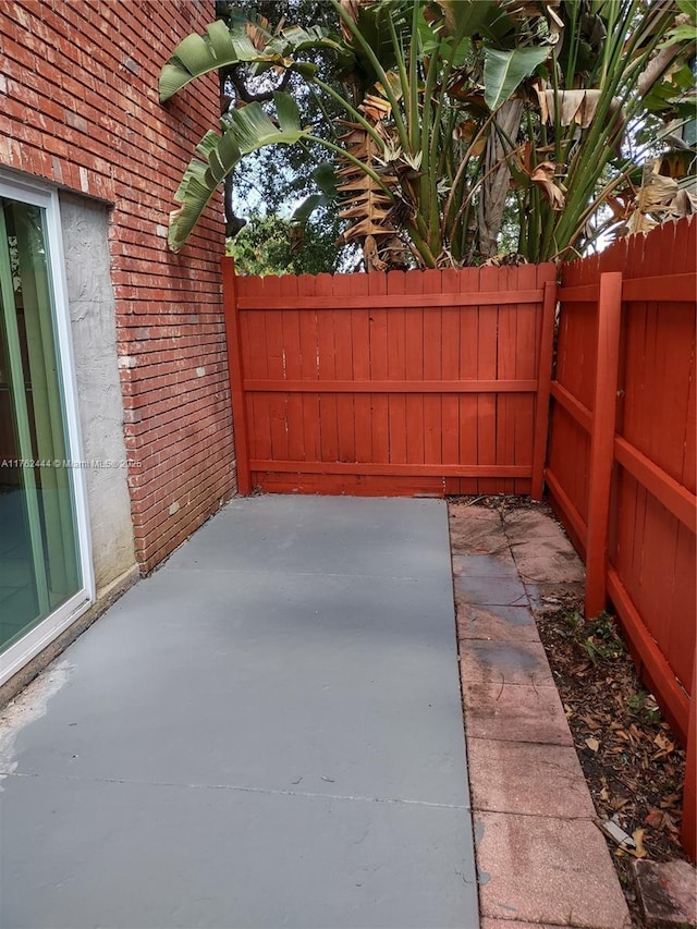 view of patio featuring fence