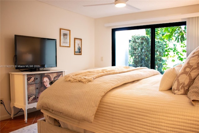 bedroom featuring tile patterned floors and a ceiling fan