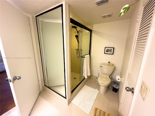 full bath with tile patterned flooring, visible vents, a shower stall, and toilet