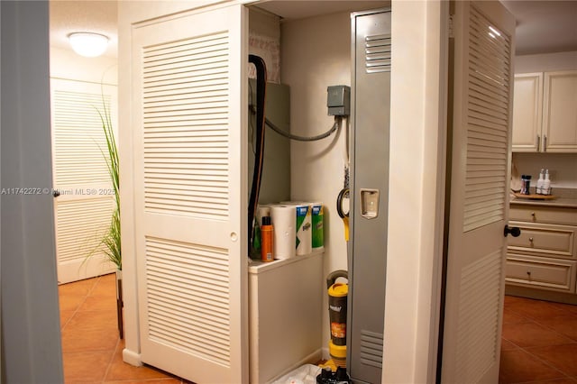 laundry area featuring light tile patterned flooring and laundry area