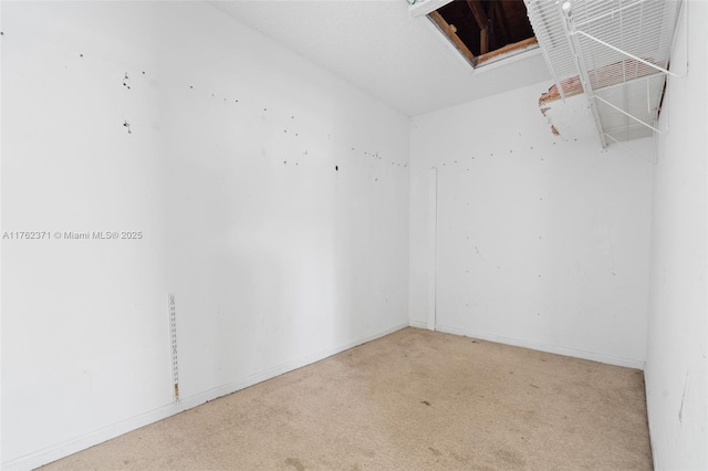 carpeted empty room with baseboards